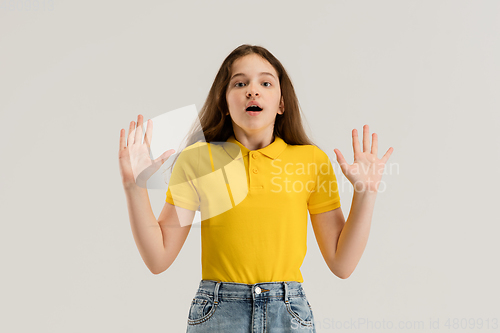 Image of Caucasian girl isolated on white studio background. Copyspace. Childhood, education, emotions concept