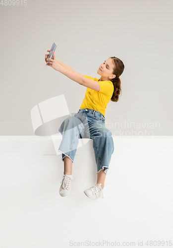 Image of Caucasian girl isolated on white studio background. Copyspace. Childhood, education, emotions concept