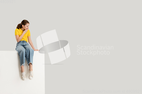 Image of Caucasian girl isolated on white studio background. Copyspace. Childhood, education, emotions concept