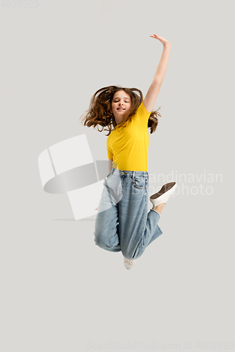 Image of Caucasian girl isolated on white studio background. Copyspace. Childhood, education, emotions concept