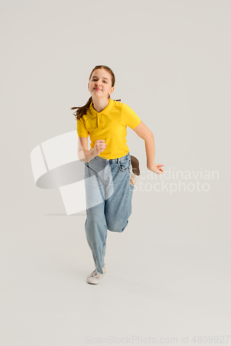 Image of Caucasian girl isolated on white studio background. Copyspace. Childhood, education, emotions concept