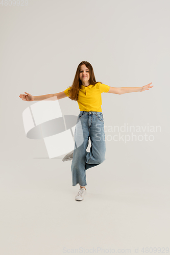 Image of Caucasian girl isolated on white studio background. Copyspace. Childhood, education, emotions concept
