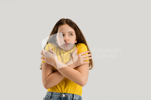 Image of Caucasian girl isolated on white studio background. Copyspace. Childhood, education, emotions concept