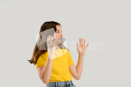 Image of Caucasian girl isolated on white studio background. Copyspace. Childhood, education, emotions concept