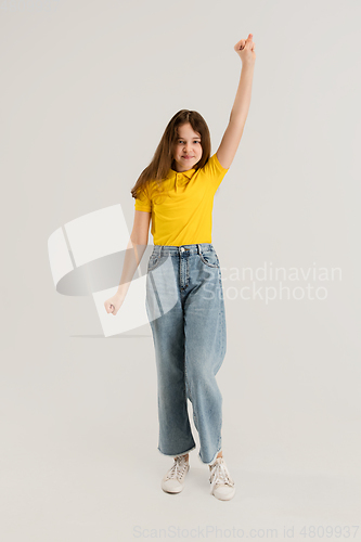 Image of Caucasian girl isolated on white studio background. Copyspace. Childhood, education, emotions concept