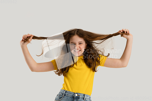 Image of Caucasian girl isolated on white studio background. Copyspace. Childhood, education, emotions concept