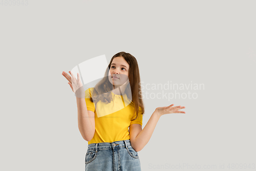 Image of Caucasian girl isolated on white studio background. Copyspace. Childhood, education, emotions concept