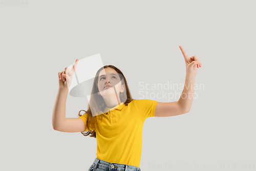 Image of Caucasian girl isolated on white studio background. Copyspace. Childhood, education, emotions concept