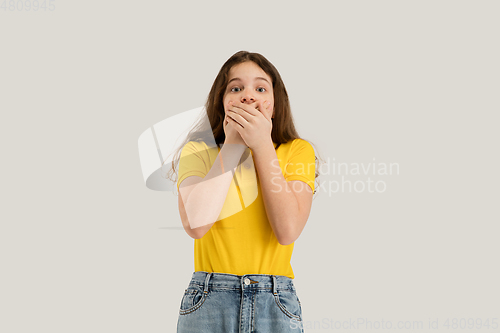 Image of Caucasian girl isolated on white studio background. Copyspace. Childhood, education, emotions concept