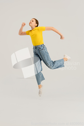 Image of Caucasian girl isolated on white studio background. Copyspace. Childhood, education, emotions concept