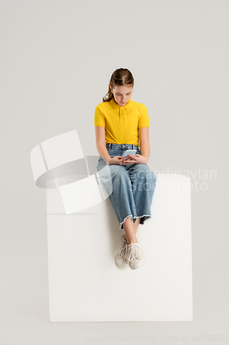 Image of Caucasian girl isolated on white studio background. Copyspace. Childhood, education, emotions concept