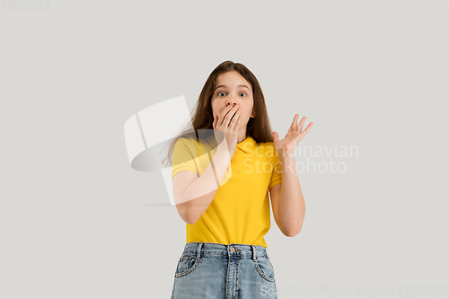 Image of Caucasian girl isolated on white studio background. Copyspace. Childhood, education, emotions concept