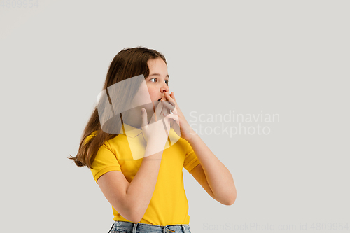 Image of Caucasian girl isolated on white studio background. Copyspace. Childhood, education, emotions concept