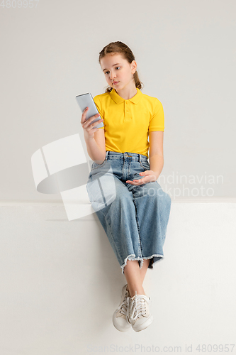 Image of Caucasian girl isolated on white studio background. Copyspace. Childhood, education, emotions concept