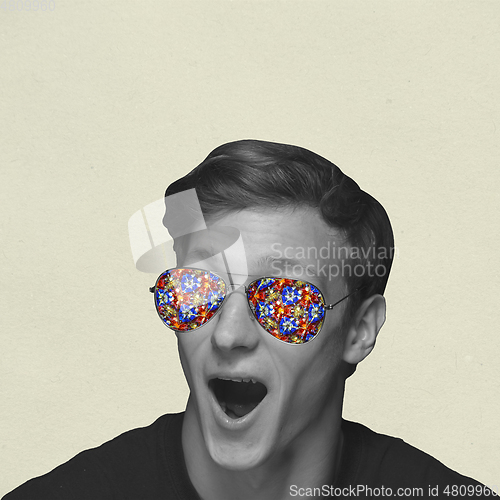 Image of Contemporary art collage, modern design. Retro style. Shocked, astonished man in sunglasses full of colorful flowers