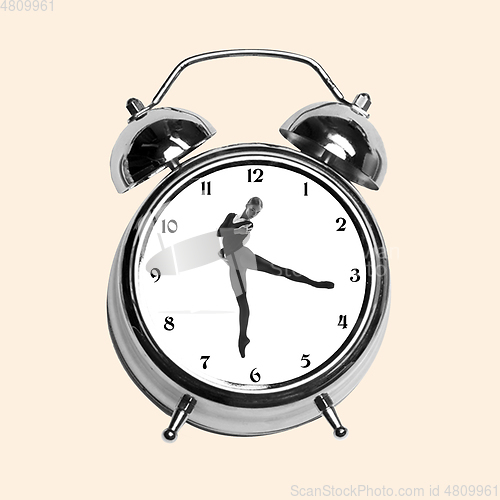 Image of Contemporary art collage, modern design. Retro style. Tender ballerina dancing in old-fashioned clock on yellow background