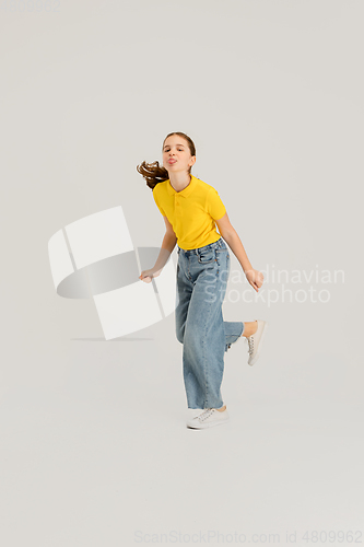 Image of Caucasian girl isolated on white studio background. Copyspace. Childhood, education, emotions concept