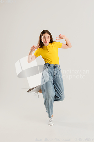 Image of Caucasian girl isolated on white studio background. Copyspace. Childhood, education, emotions concept