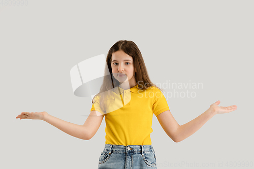 Image of Caucasian girl isolated on white studio background. Copyspace. Childhood, education, emotions concept