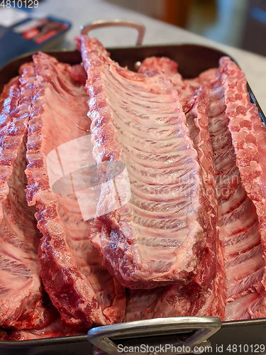 Image of raw seasoned bbq ribs ready for cooking