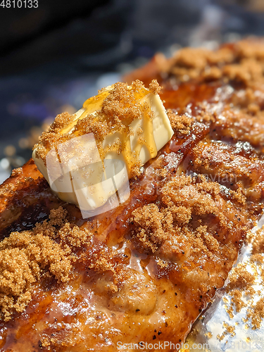 Image of Close-up view of delicious juicy meat with ribs on grill