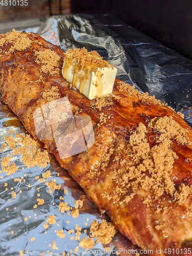 Image of Close-up view of delicious juicy meat with ribs on grill