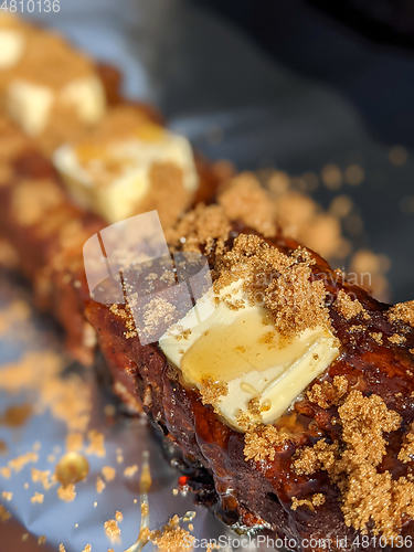 Image of Close-up view of delicious juicy meat with ribs on grill