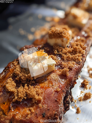 Image of Close-up view of delicious juicy meat with ribs on grill