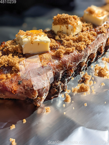 Image of Close-up view of delicious juicy meat with ribs on grill