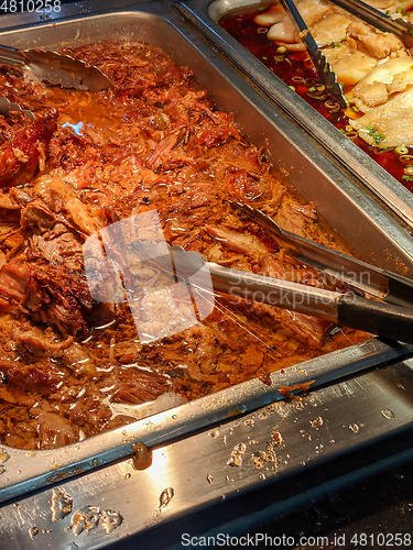 Image of trays of seafood and bbq at a restaurant