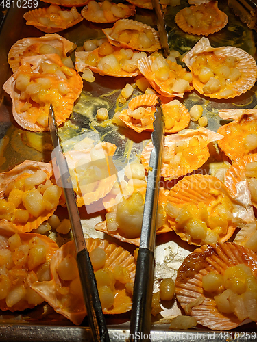 Image of trays of seafood and bbq at a restaurant