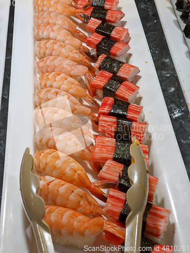 Image of trays of seafood and bbq at a restaurant