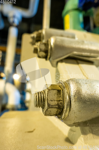 Image of Equipment, cables and piping as found inside of industrial plant