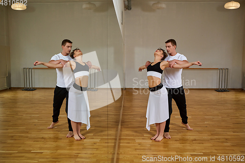 Image of beautiful couple dancing tango