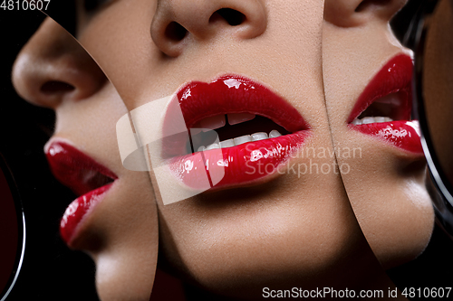 Image of beautiful woman lips closeup with mirror reflections