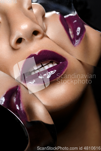 Image of beautiful woman lips closeup with mirror reflections