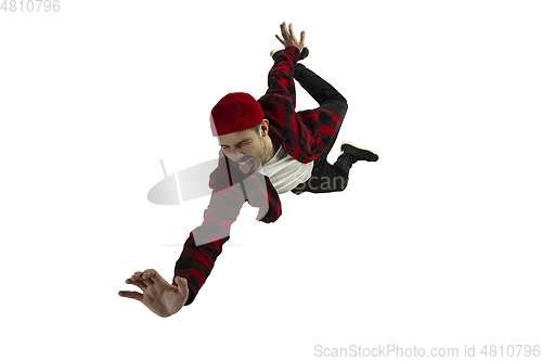 Image of A second before falling - young man falling down with bright emotions and expression