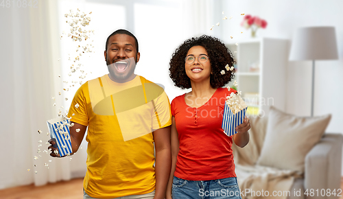 Image of happy african american couple with popcorn