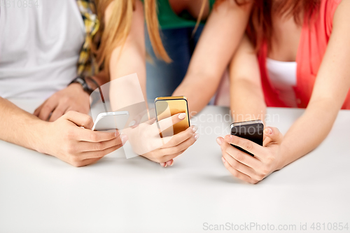 Image of close up of hands with smartphones