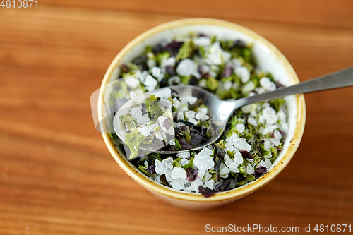 Image of close up of flavored sea salt in bowl with spoon