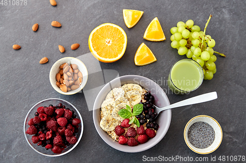 Image of cereal with berries, fruits and glass of juice