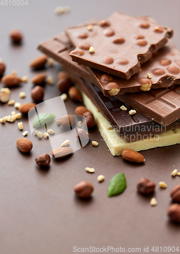 Image of close up of different chocolate bars and nuts