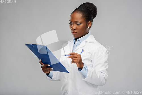 Image of african american female doctor with clipboard