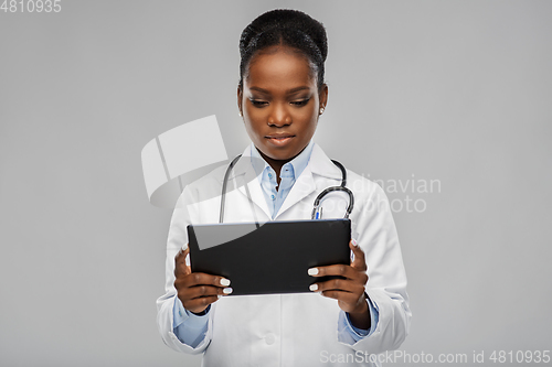 Image of african american female doctor with tablet pc