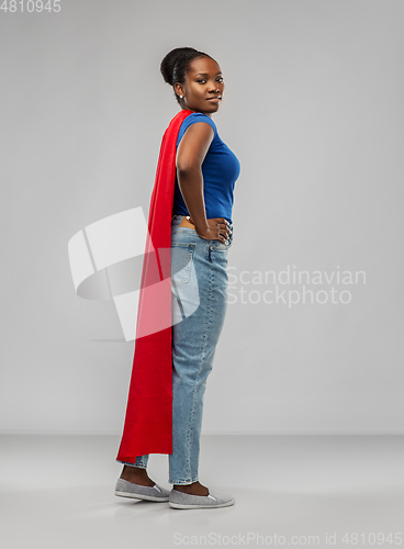 Image of african american woman in red superhero cape