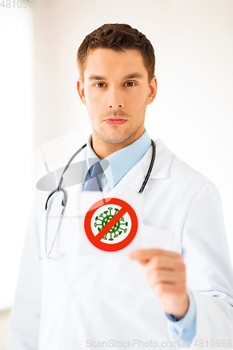 Image of male doctor holding coronavirus sign