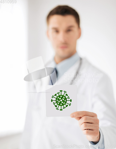 Image of male doctor holding coronavirus sign