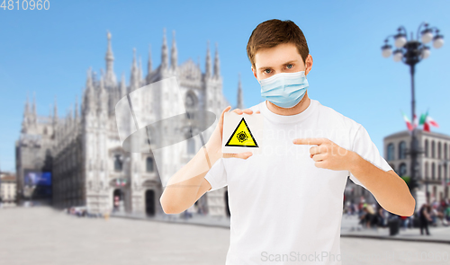 Image of man in medical mask with coronavirus sign in italy