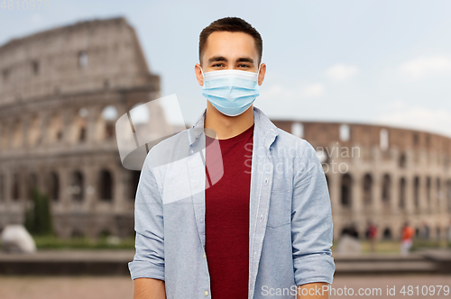 Image of man wearing protective medical mask in italy