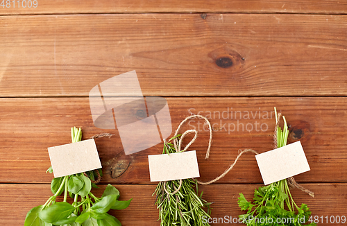 Image of greens, spices or medicinal herbs on wooden boards